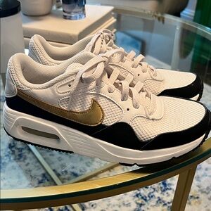Nike Women's White and Black Sneakers with Gold Accents